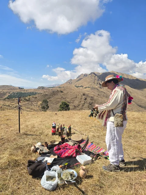 Andean ceremony leader beginning a ceremony of gratitude to the earth